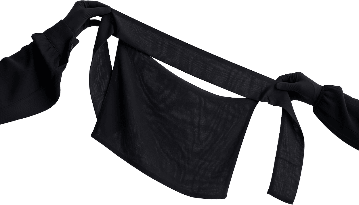 Two gloved hands holding a black niqab by its ties, the sheer face panel hanging loose