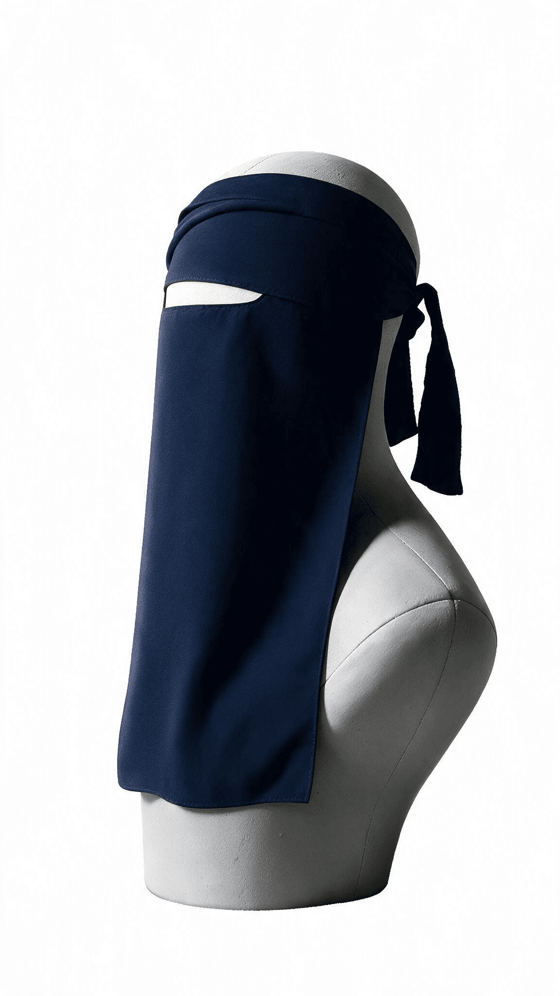 A navy niqab shown in profile on a mannequin bust, the maḥjir — the strip left open for the eyes — visible against the fabric covering the rest of the face.