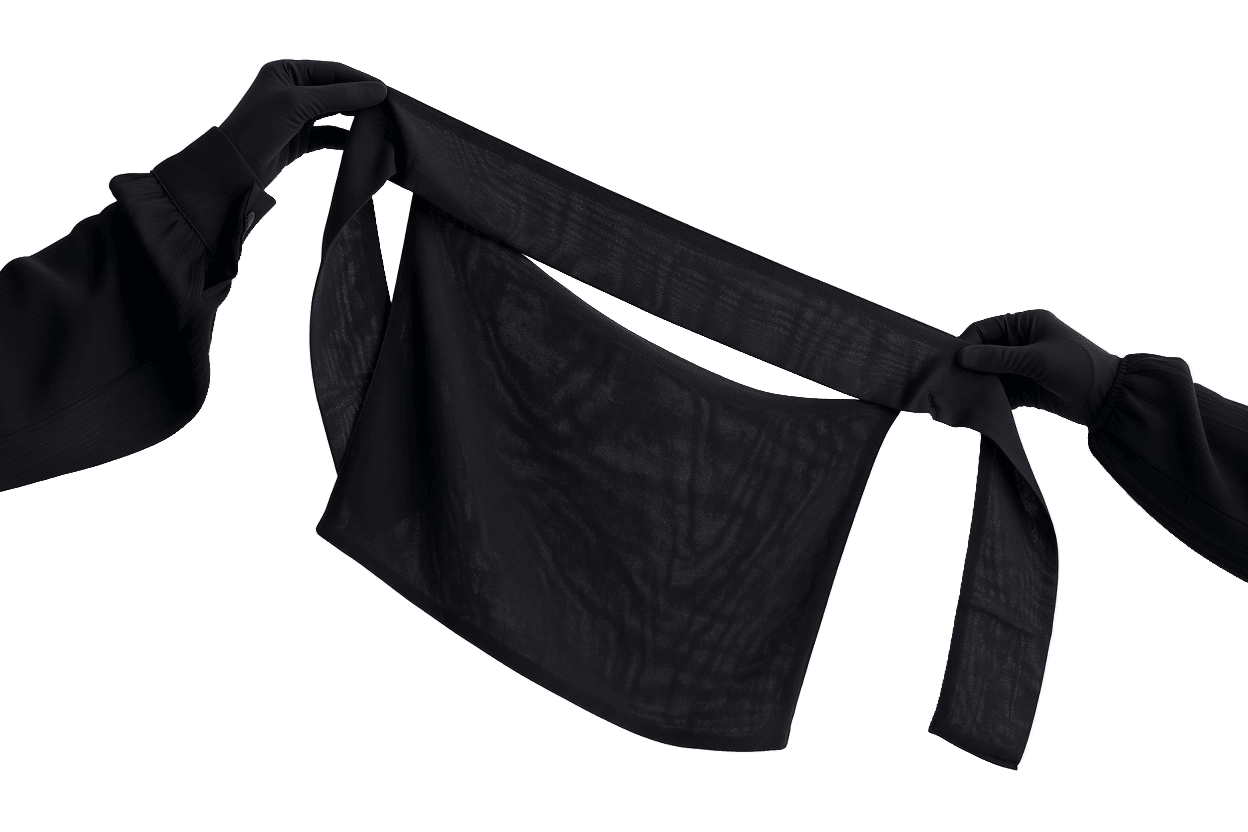 Two gloved hands holding a black niqab by its ties, the sheer face panel hanging loose against a plain white background.